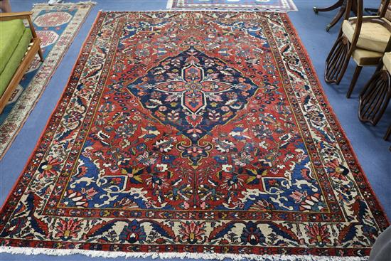 A large red and blue Bakhtiari carpet 360 x 257cm